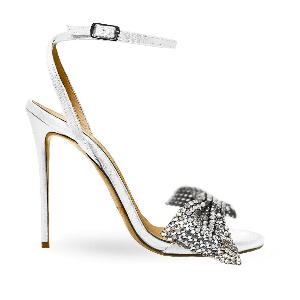 sandali gioiello per cerimonia color argento con fiocco ricoperto di cristalli e tacco a stiletto