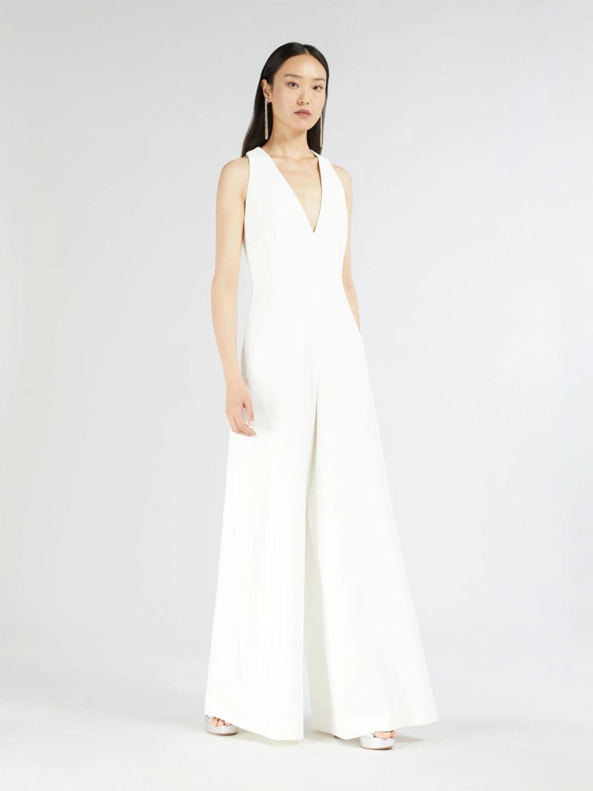 jumpsuit da sposa smanicata con cut-out sulla schiena e pantalone a palazzo