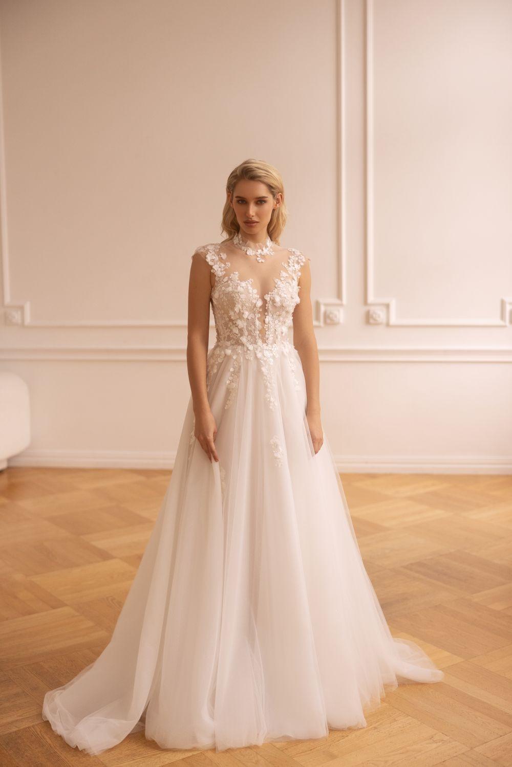 abito da sposa con scollo a illusione e pizzo- tipi di scaollatura