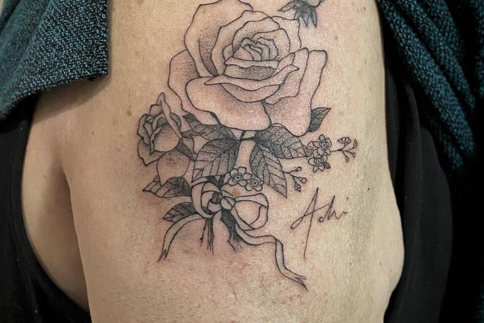 Rosa con dedica tattoo