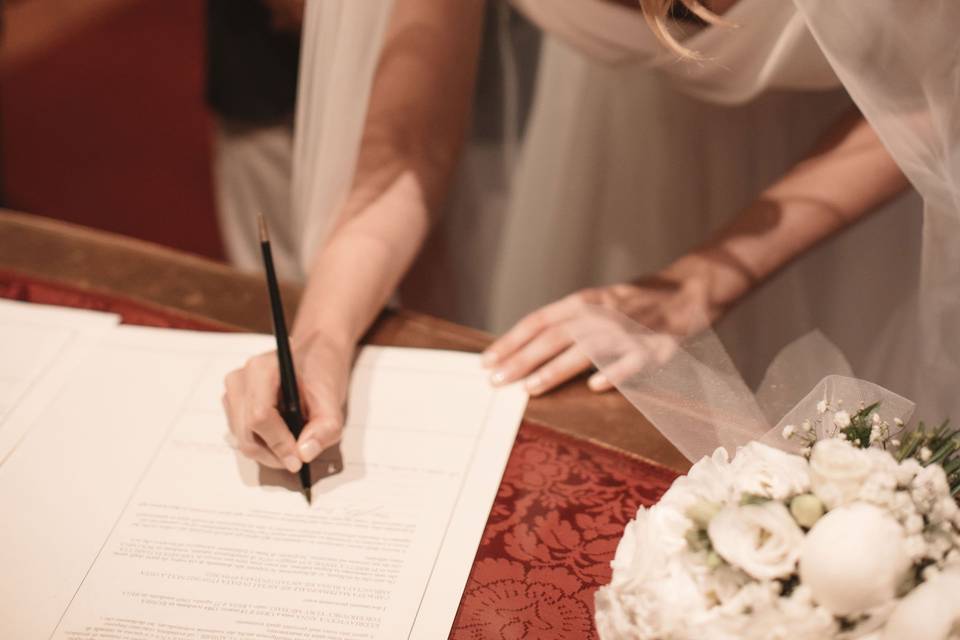 Bride signing certificate