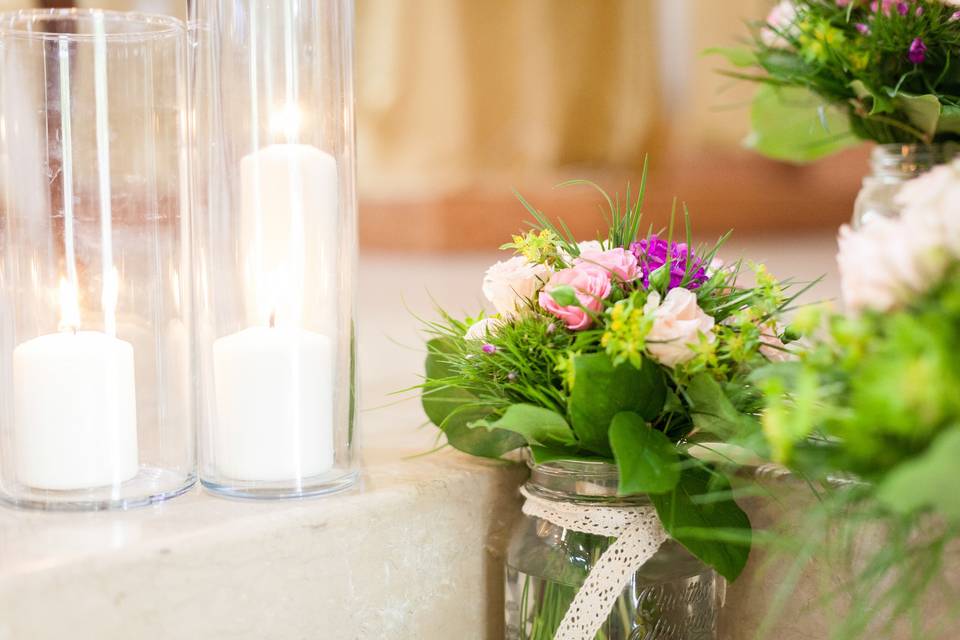 Candele rose e bouquet