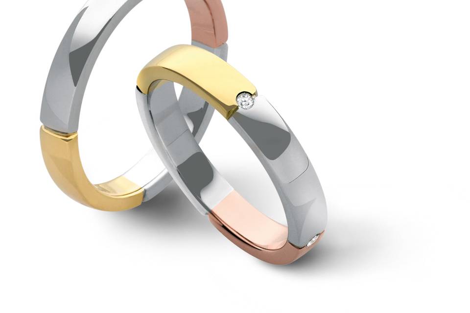 Coppia di Fedi Matrimoniali  F56 in oro rosa, bianco e giallo, con 4 diamanti nella versione donna.