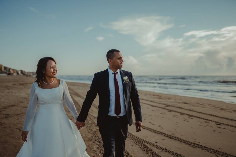 Bride and groom by the sea