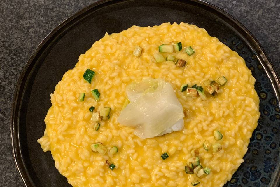 Risotto con crema di zucca e fagottini di baccalà rafols